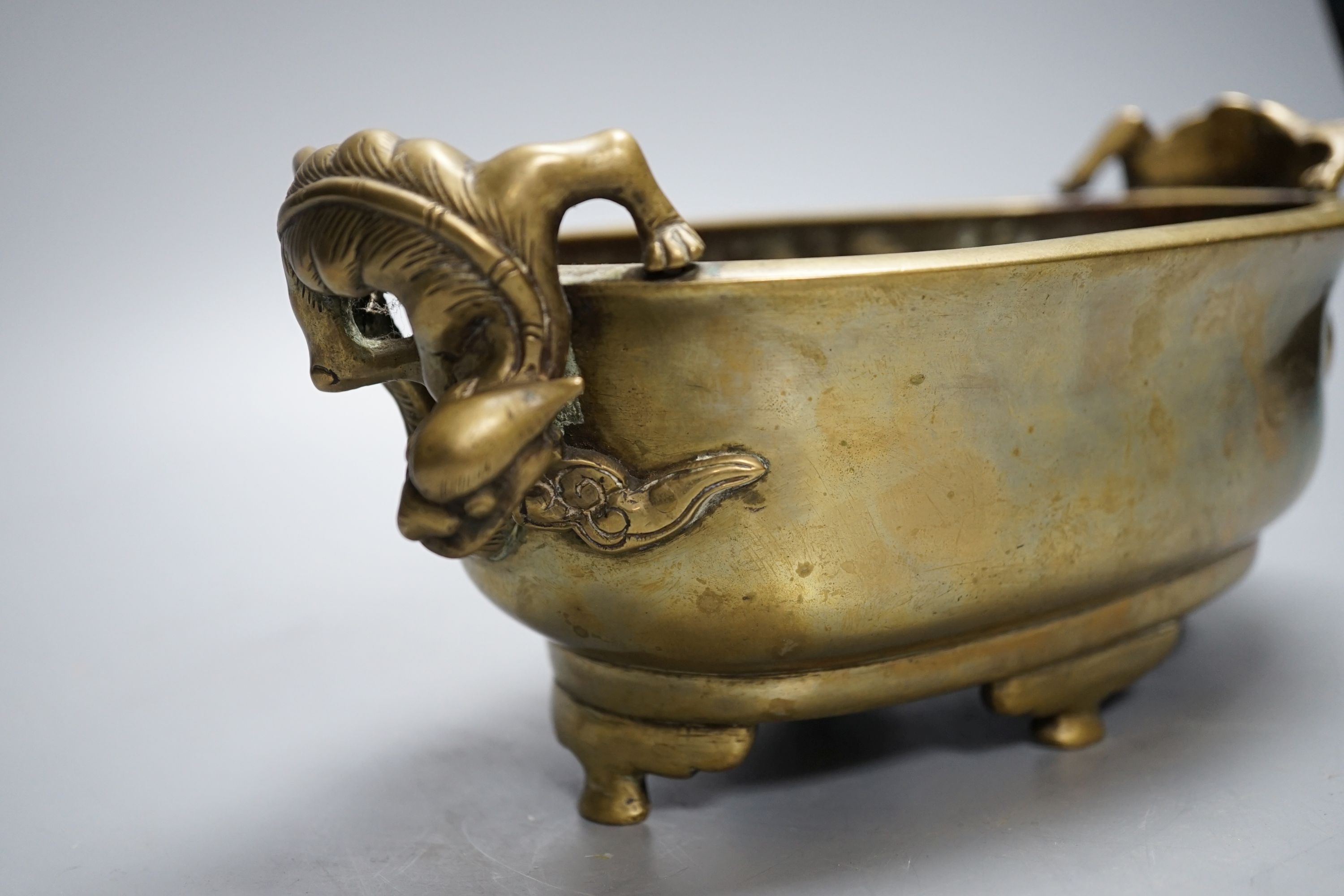 A 19th century Chinese bronze censer with ‘dragon’ handles, Xuande mark, 26cm